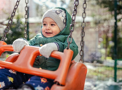 A child enjoying a swing.