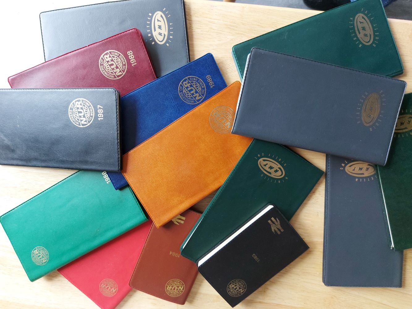 A selection of NUR union diaries, various colours, collected by the author over many years.