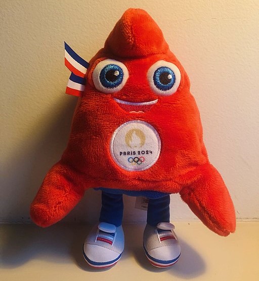 The Olympic mascot for Paris 2024. A red soft toy, based on the hat worn during the French Revolution. Triangular shape.