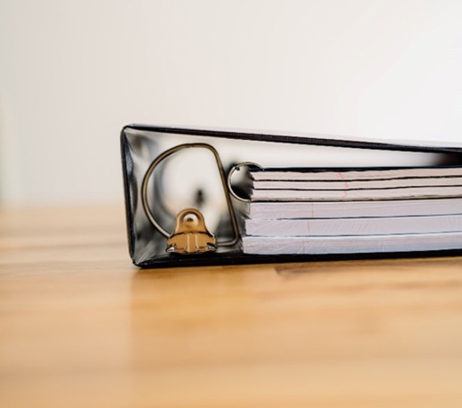 A binder containing files.