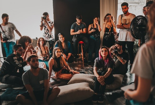A group of people sitting together in a room.