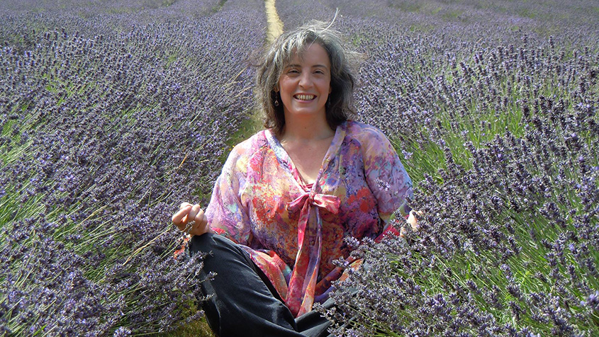 Catherine sitting in a lavender field.