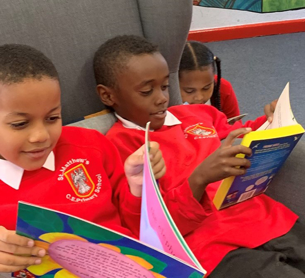 Photo of a children reading together.