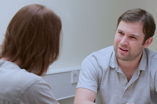 A photograph of DS Sund interviewing Mick Brough.