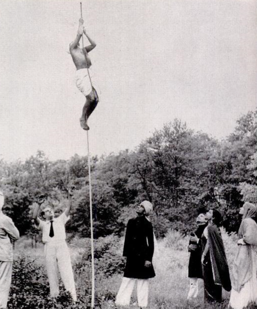 Photograph: The magician Joseph Dunninger with students from Columbia University demonstrating the Indian Rope Trick.