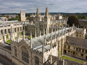 Photograph of an Oxford college with green quadrangles surrounded by traditional college buildings.