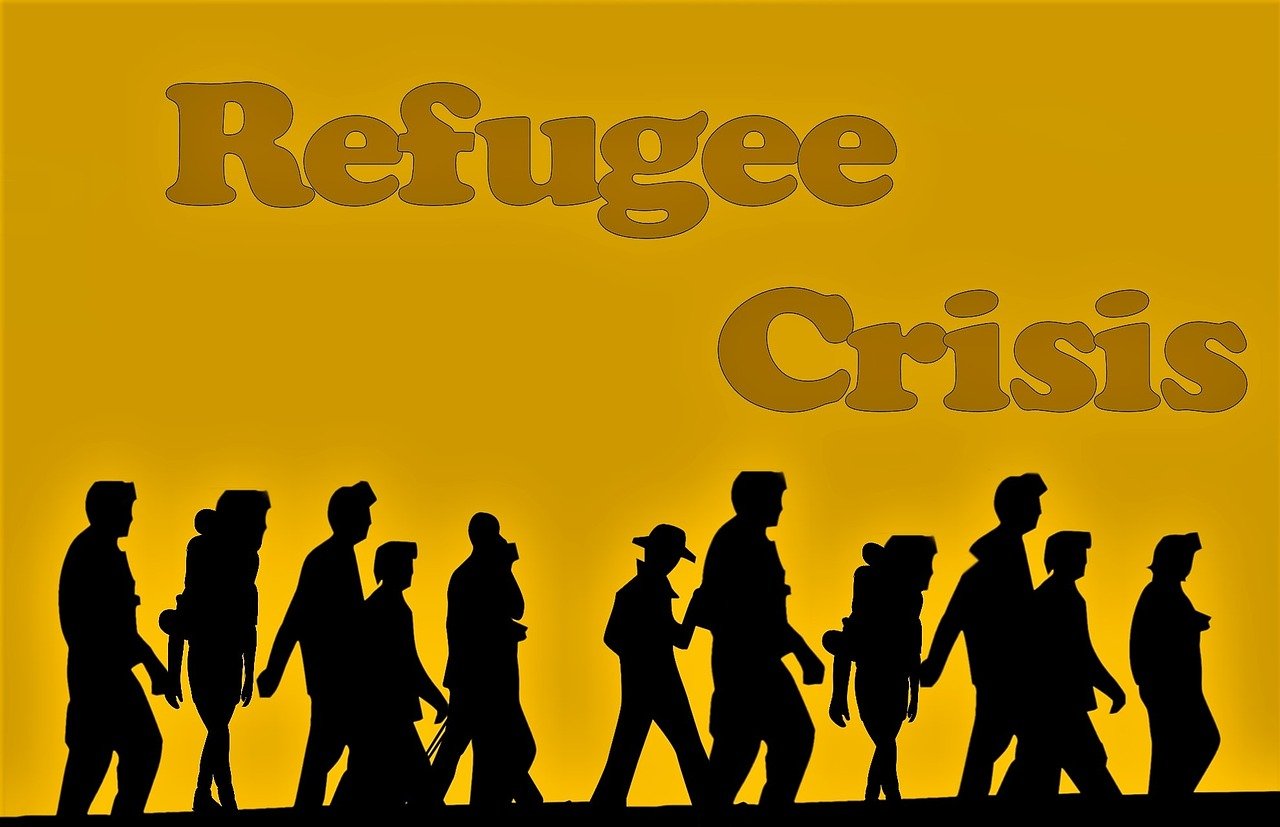 Refugee crisis title on a yellow background with images of people walking with large bags