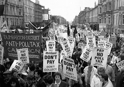 A group of people protesting the Poll Tax in a Scottish street