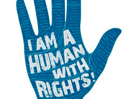 Image of a hand with the words ‘I am a human with rights’ written across it.