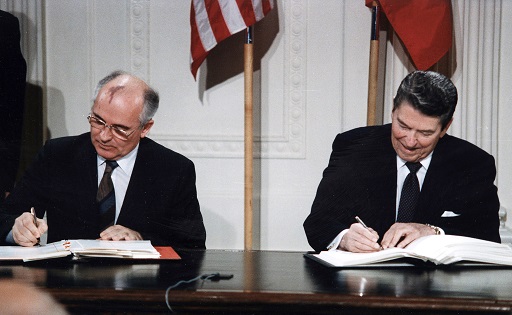 A photograph of Gorbachev and Reagan signing the INF Treaty.