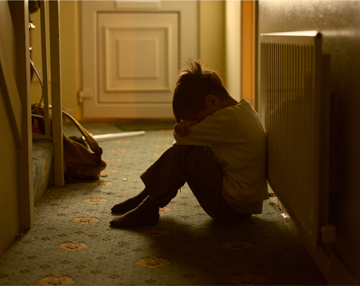 A photograph of an upset child