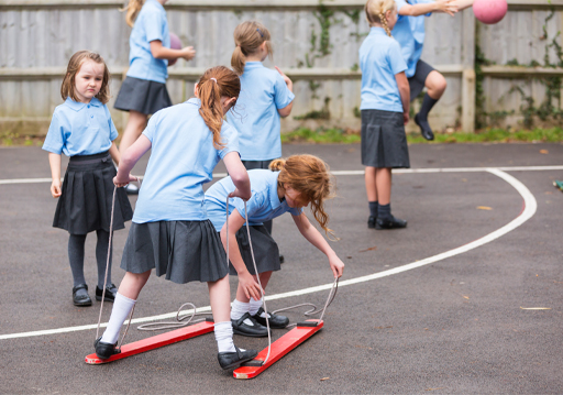 A photograph of children playing in a school playground