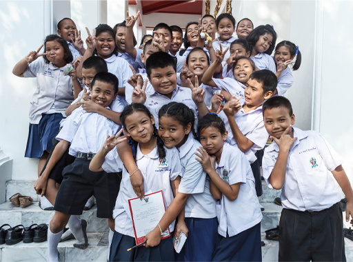 A photograph of a group of children, smiling