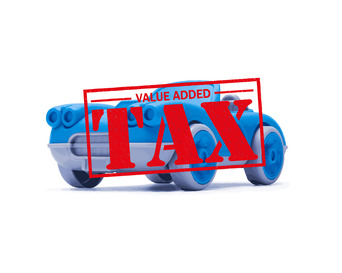 A toy car, with a VAT stamp on top of the image.