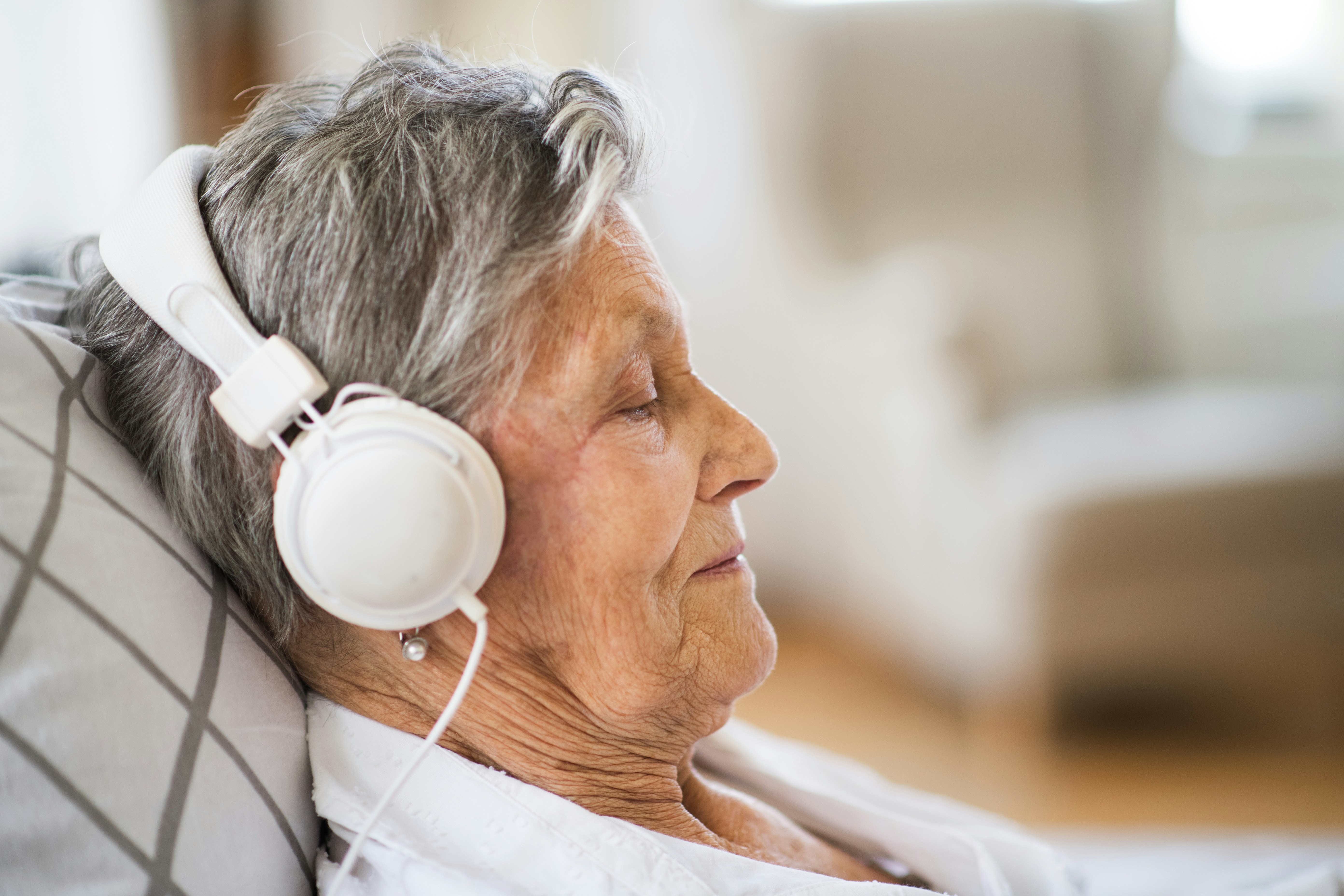 Older lady with headphones on