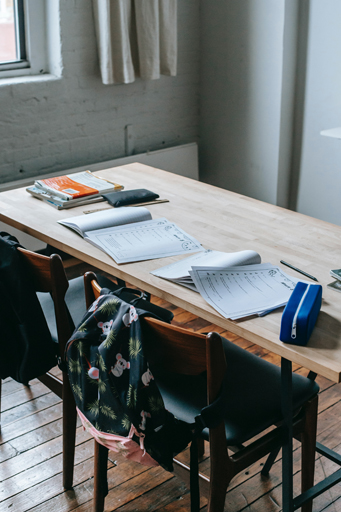 A desk with papers on it.