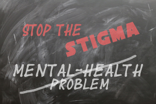 The words ‘Mental health problems’ with a line through them, with the words ‘Stop the stigma’ above them.