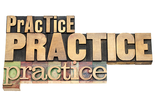 Image of 'PrAcTicE, PRACTICE, practice' carved out of wooden blocks