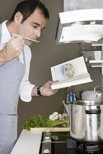 Photo of a man cooking.