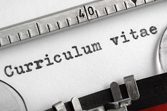 Photo of a typewriter with the words 'Curriculum vitae' typed on the page.