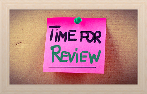 Photo of a pink Post-it note with 'Time for review' written on it.