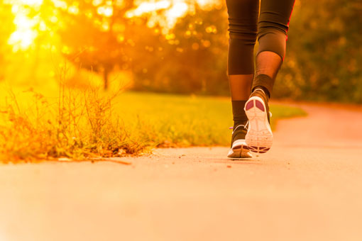 Photo of a runner running along a track.