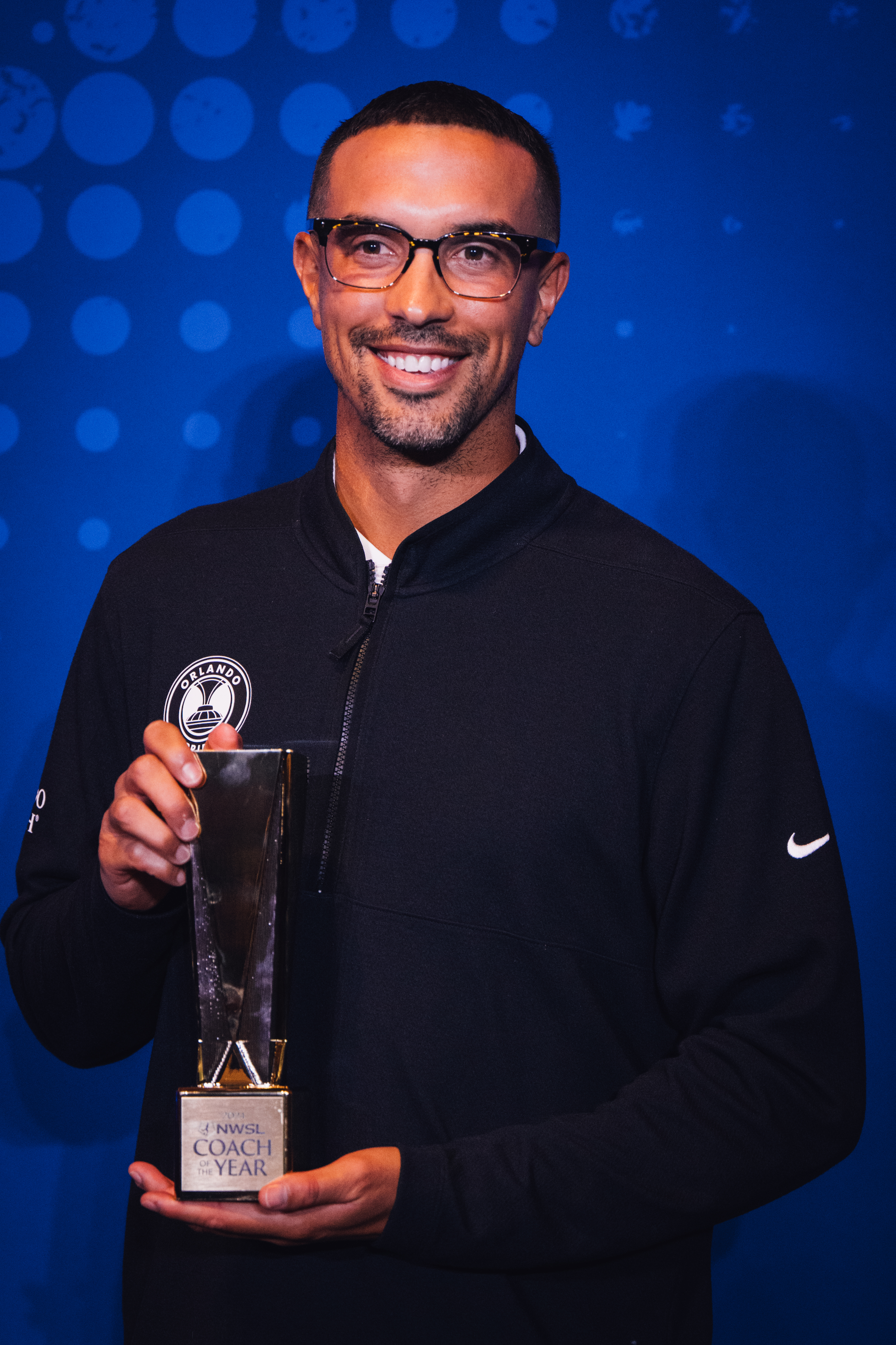 Seb Hines receiving the Coach of the Year Award in the NWSL.