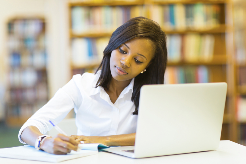 Female college student studying in the library