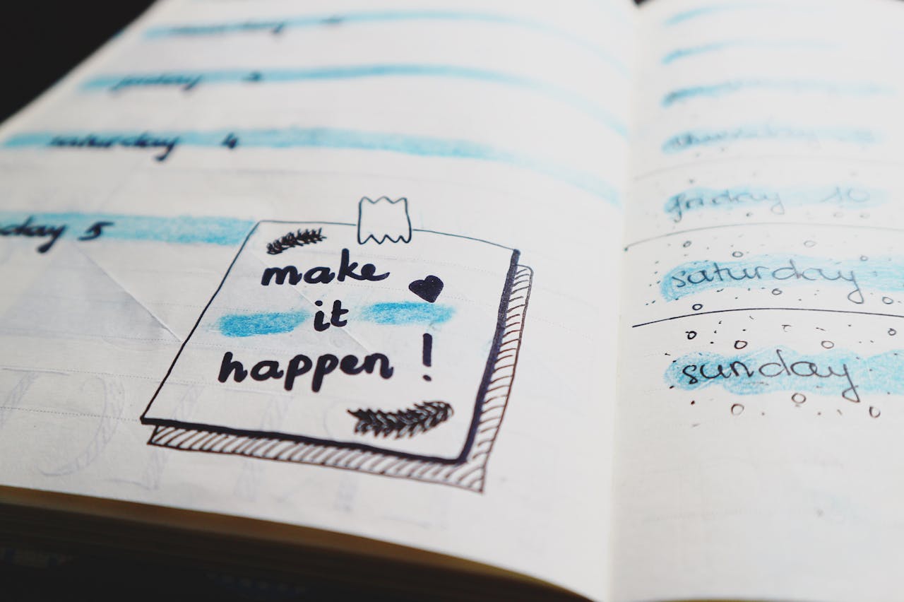 Planner diary with the note 'make it happen!'