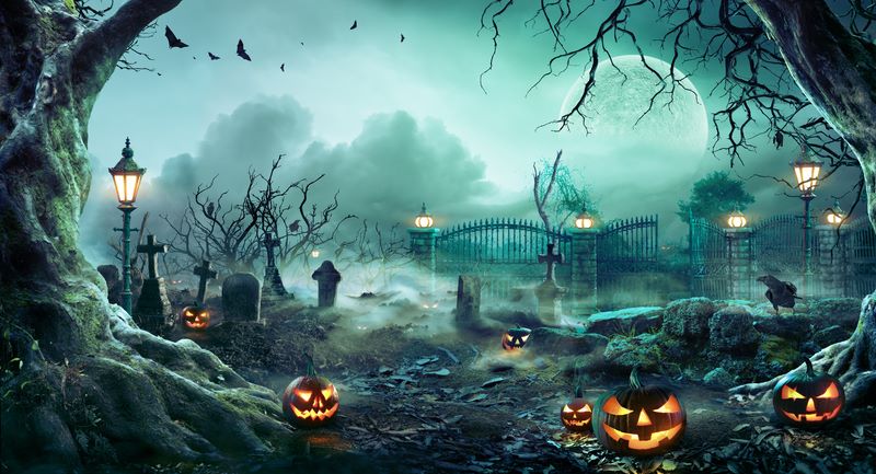 Jack O` Lanterns in a spooky graveyard 