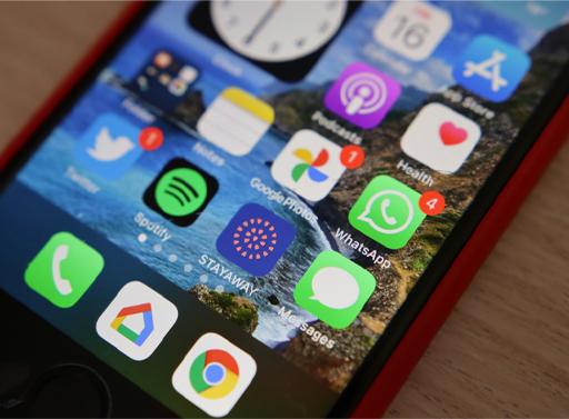 Image of a smart phone with multiple applications on the screen.