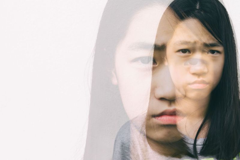 Sad girl - exposure showing two of her depicting masking