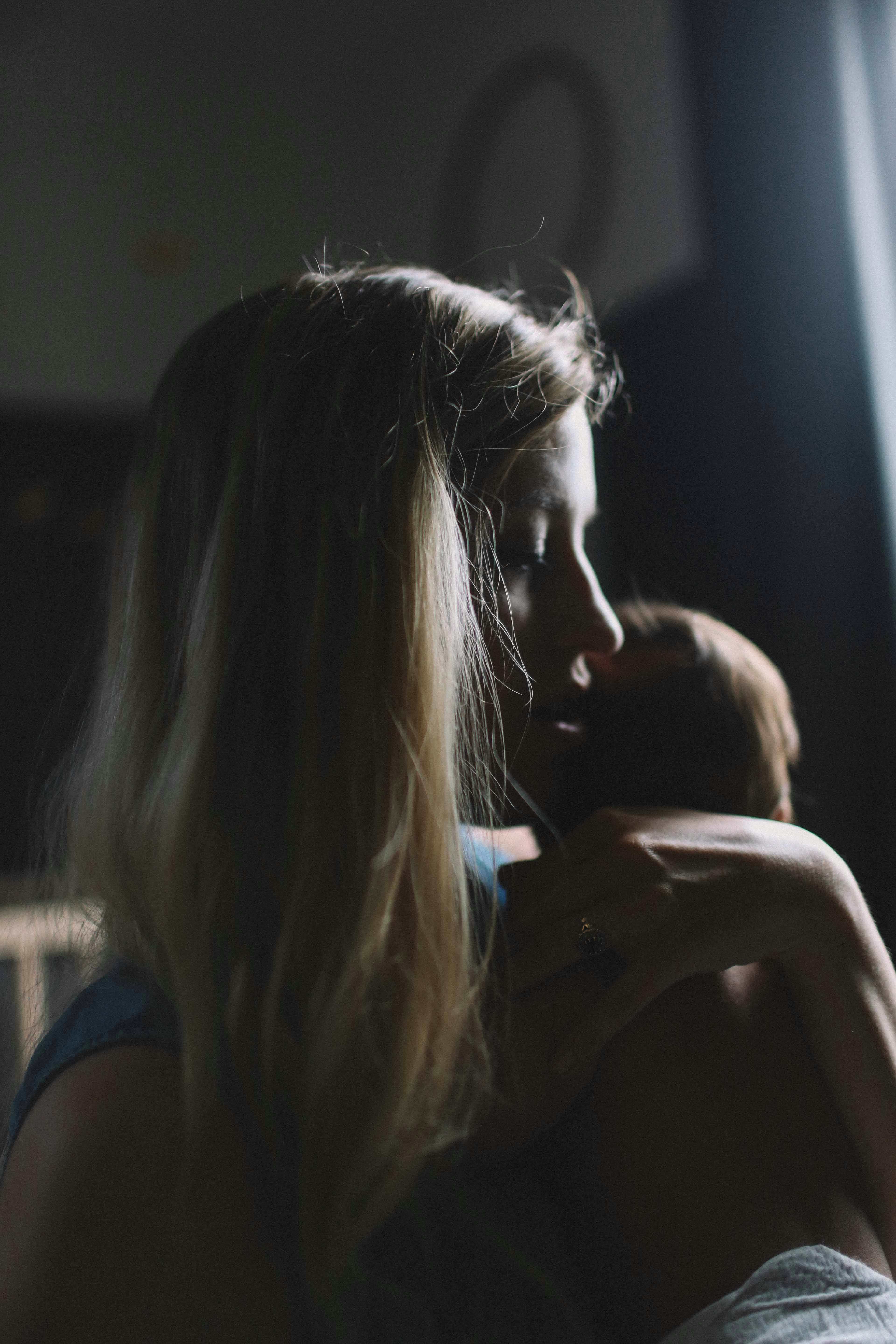 A woman holding a young baby