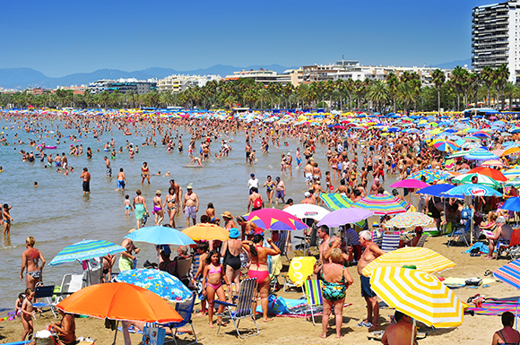 Photograph of vacationers in Llevant beach in Spain.