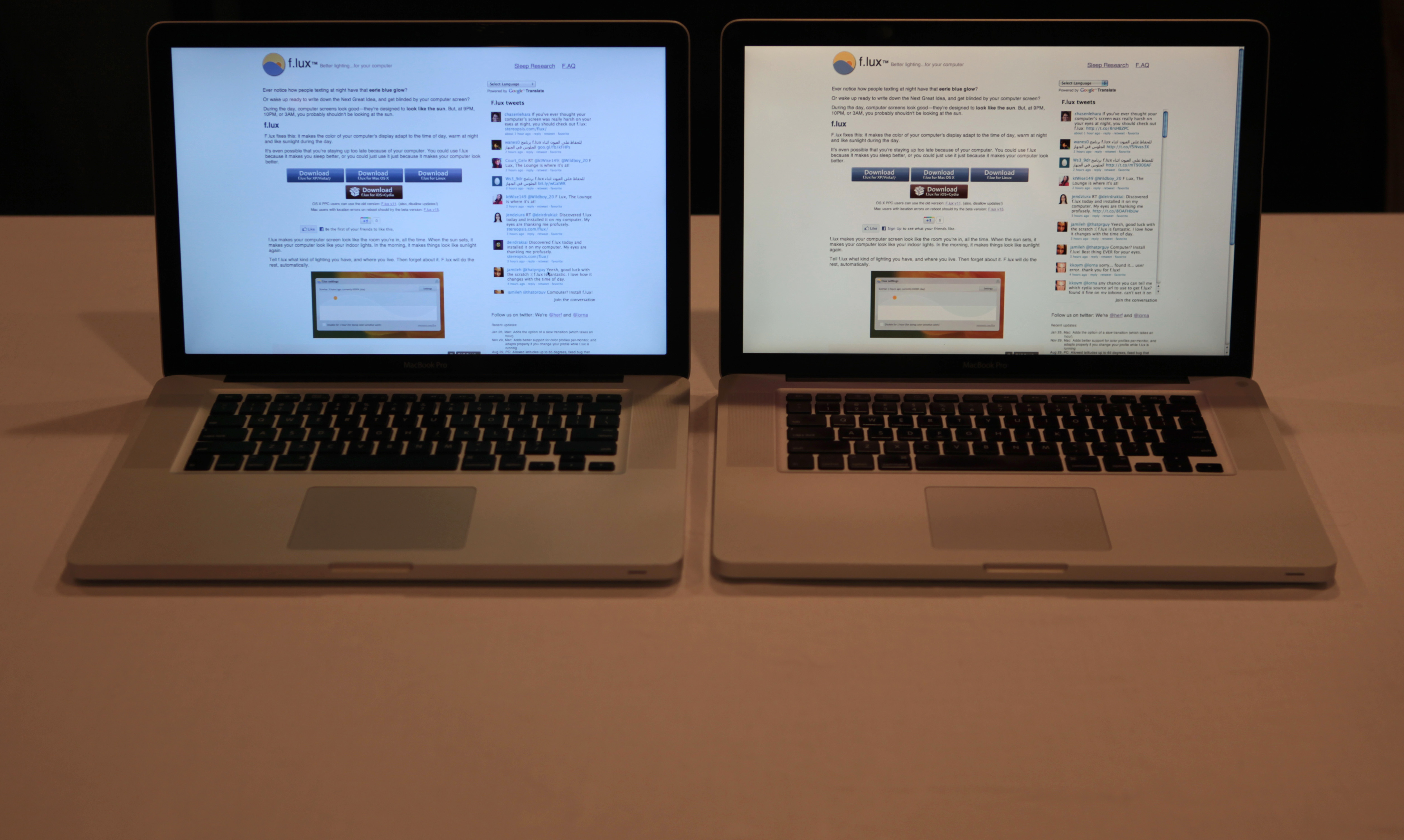 Two laptops side by side, showing the same page on the screen. The screen on the left has appears more white/blue; the screen on the right appears more yellow/red
