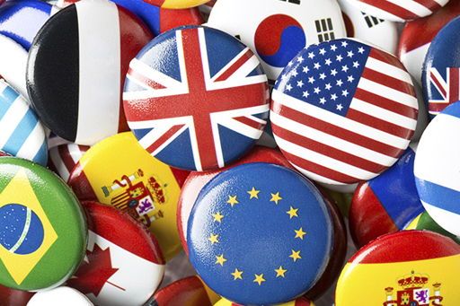 A large number of badges displaying the flags of various countries and the European Union (EU).