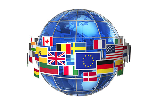 The image is a globe of the earth with the flags of various nations displayed around it.