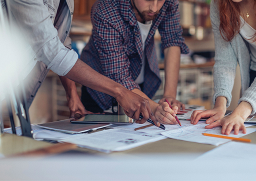 A photograph of people working collaboratively.