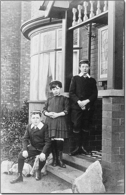 A photograph of three children