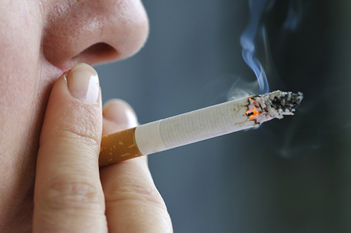 This is a close-up image of a person smoking.