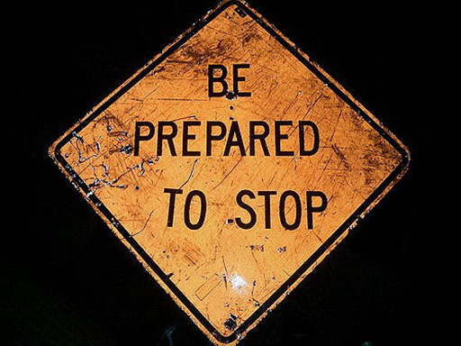 An image of a sign reading: ‘Be prepared to stop’.