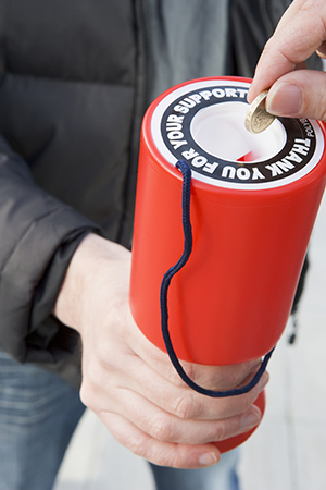 A photo of a collecting tin for charity