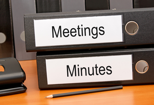 Photo of two folders labelled meetings and minutes