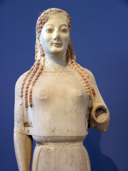 Statue of a young woman wearing a peplos, or heavy woolen garment, over her chiton.