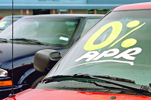 This is a photograph of a car with ‘0% APR’ written on the windscreen.