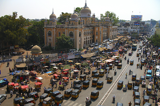 A photograph of a main street in Hyderabad, India.