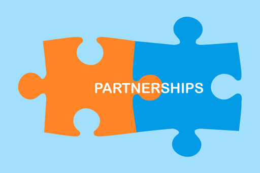 A graphic of two pieces of a jigsaw labelled ‘Partnerships’.