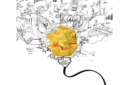 A graphic showing a lightbulb represented by a drawing and a ball of scrunched yellow paper.