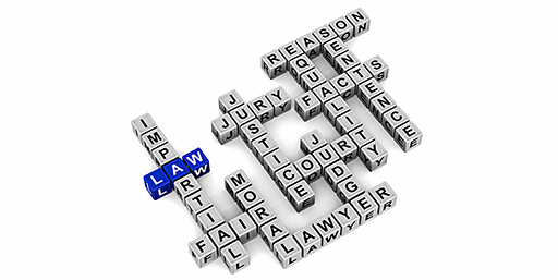Picture of words associated with law set out as a completed jigsaw.