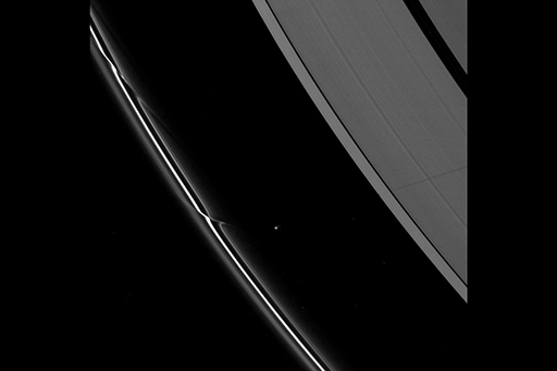 This is an image of Prometheus perturbing Saturn’s F-ring.
